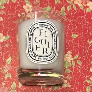 Diptyque Floral Scented Candle with Red and Green Accents